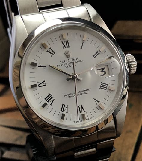 rolex oyster perpetual white dial domed bezel arabic numerals